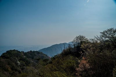 Scenic view of sea and mountains against sky