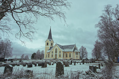 Panoramic shot of building against sky during winter