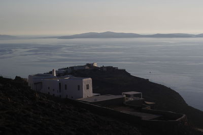 High angle view of sea and buildings against sky