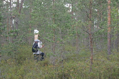 Person sitting in forest