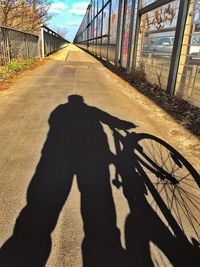 Shadow of people on walkway