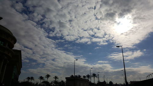 Low angle view of building against cloudy sky