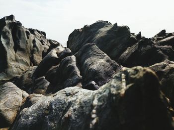 Low angle view of rock formation against clear sky