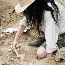 Paleontologist working on sand