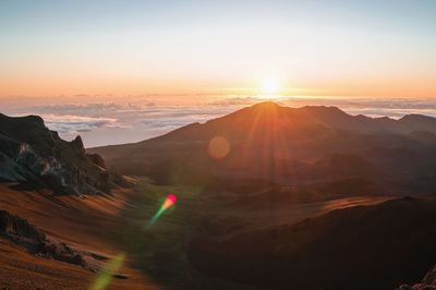 Scenic view of mountains against sky during sunset