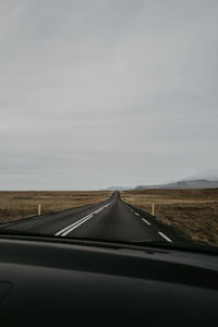 Empty road against sky