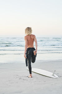 Full length of man standing at beach