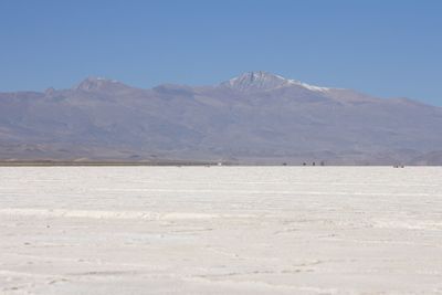 Scenic view of snowcapped mountains against clear sky