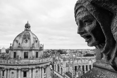 Portrait of cathedral against buildings in city