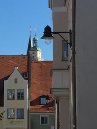 Residential buildings against blue sky