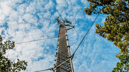 Low angle view of cables against sky