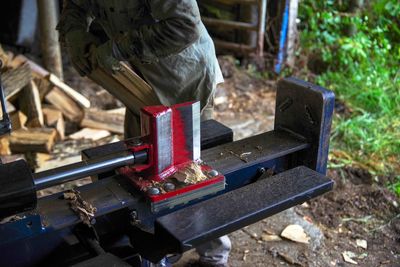 Low section of man working at workshop