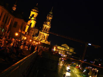 Illuminated buildings in city at night