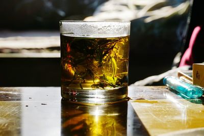 Close-up of beer glass on table