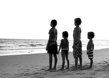 Rear view of people on beach