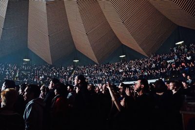 Low angle view of people at music concert