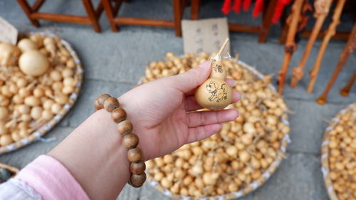 High angle view of woman holding food