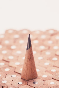 Close-up of pencil on table against white background