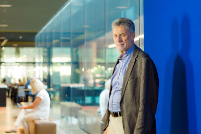 Portrait of businessman standing in office