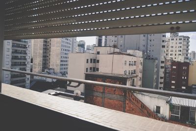 Buildings in city seen through window