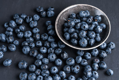 High angle view of blueberries in bowl on table