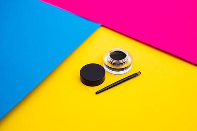 High angle view of yellow colored pencils on table