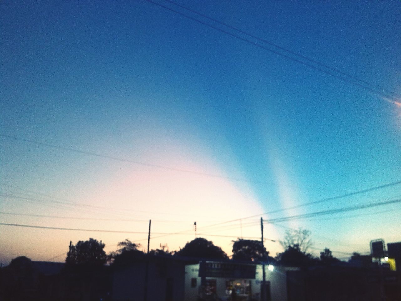 building exterior, built structure, architecture, blue, power line, low angle view, silhouette, sky, electricity, cable, house, electricity pylon, dusk, residential structure, power supply, clear sky, residential building, building, copy space, street light