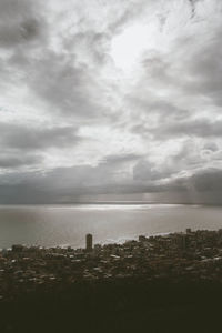 Scenic view of sea against cloudy sky