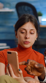 Young woman using mobile phone