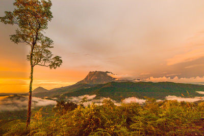 Scenic view of mountains against sky during sunset