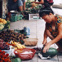 Midsection of woman at market stall