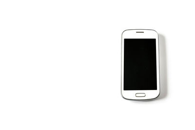 Close-up of smart phone against white background