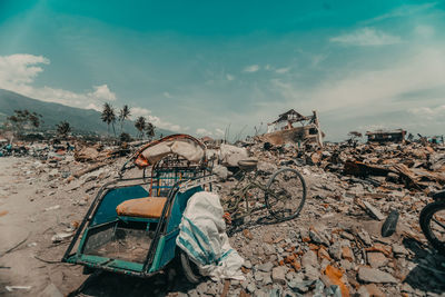 Abandoned house on beach against sky