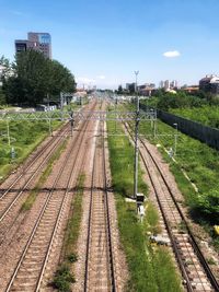 High angle view of railroad tracks in city against sky