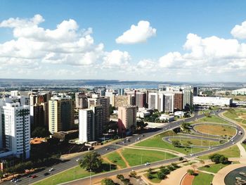 High angle view of city against cloudy sky