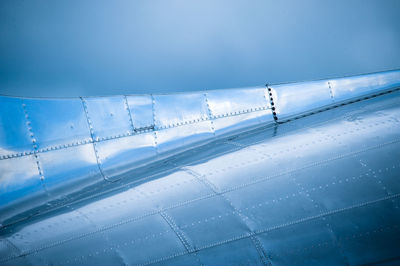 Scenic view of airplane against sky during winter