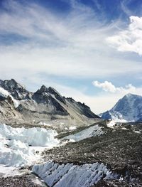 Scenic view of snow covered mountains against sky