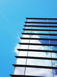 Low angle view of building against blue sky