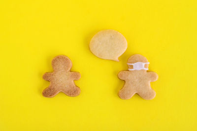 Close-up of cookies against yellow background