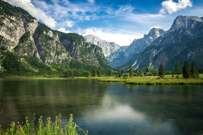 Scenic view of lake and mountains against sky