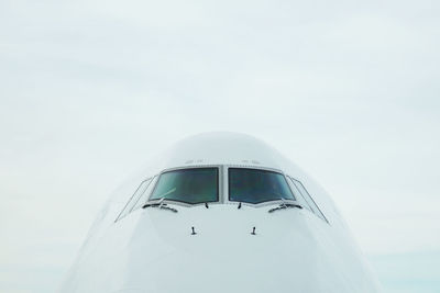 Close-up of airplane against clear sky