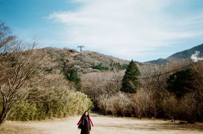 Man on mountain against sky