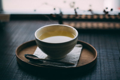 Close-up of coffee cup on table