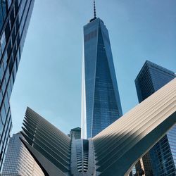 Low angle view of one world trade center in city against sky