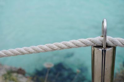 Close-up of rope on railing