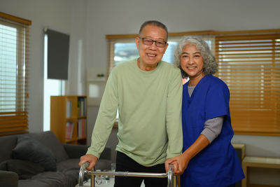 Portrait of young man standing in gym