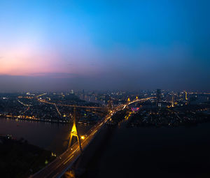 High angle view of illuminated buildings in city at night