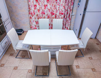 High angle view of tables and chairs at home