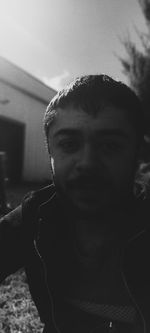 Close-up portrait of young man at home