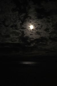 Low angle view of moon in sky at night